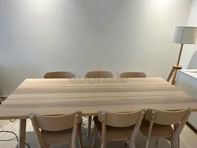 Light wood dining table with 6 matching chairs - simple modern set