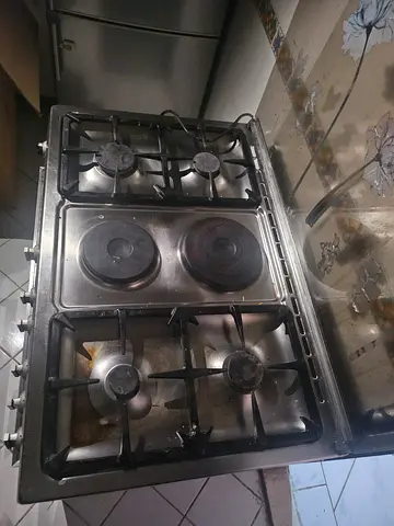 Used 4-Burner Gas Stove with 2 Electric Hotplates - Stainless Top...price not negotiable