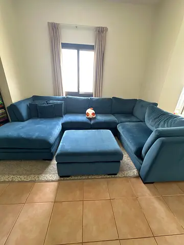 Teal blue fabric sectional sofa with ottoman - good condition