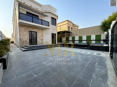 Al Muwaihat 2 villa with a swimming pool, priced inclusive of electricity, water, and air conditioning, located on the main street, ready for immediat