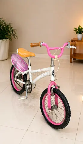 Kids pink and white 14-inch bicycle with training wheels (good condition)