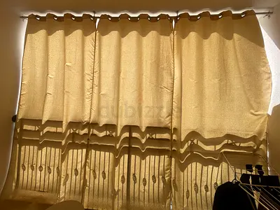 Beige eyelet curtains (set) — good condition, light-filtering