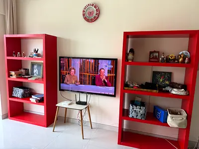 2 of red open bookcases / display shelves - good condition