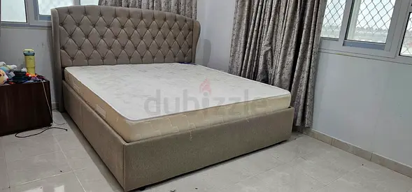 Queen upholstered bedframe — brand New