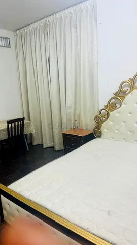 King bed with mattress and bedside table, ready to use