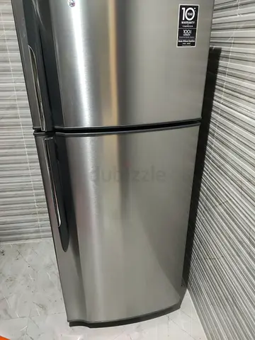 Silver double-door refrigerator, top freezer - good condition