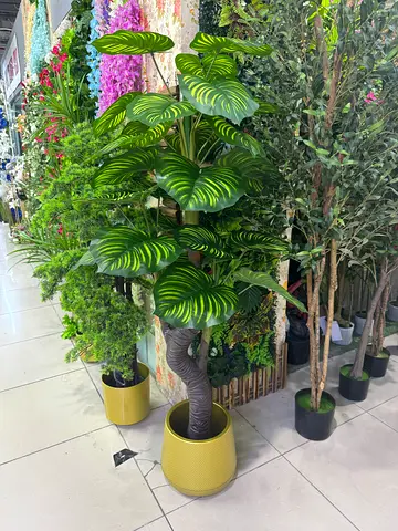 Large artificial potted calathea and assorted faux plants