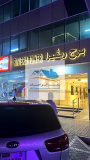 Al Khan Riviera Tower, a two-bedroom apartment with a living room, two bathrooms, a kitchen, and a b