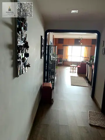 For sale and freehold ownership in Ajman, Corniche Towers, a two-bedroom apartment with a living room, master bedrooms, spacious.