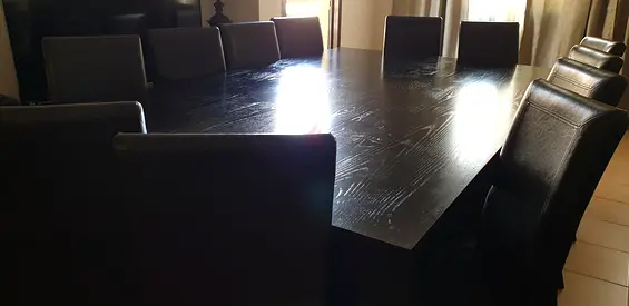 Solid Dark Wood Dining Table with 10 faux leather Chairs - Good Condition
