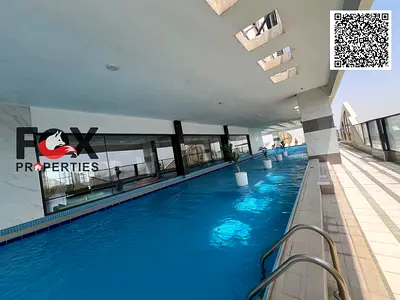 Two bedrooms and a living room for annual rent, with free gym and swimming pool. Excellent spaces, one month free. Prime location in Al Rashidiya 1.