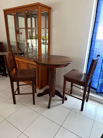 Tall solid wood round table with two chairs