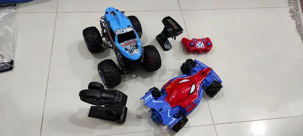 Two Remote Control Monster Trucks with Controllers - Used