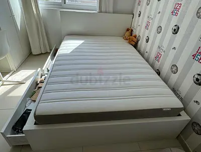 Ikea double bed with mattress underneath 2 storage drawers available in perfect condition