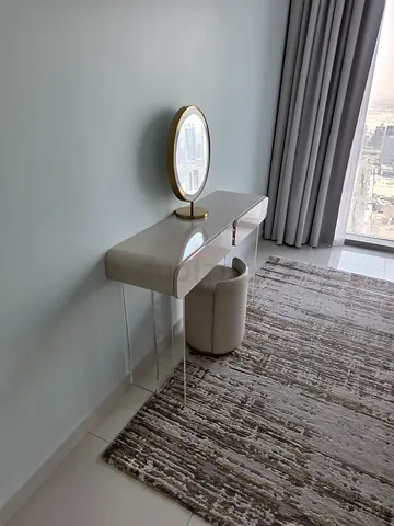 Modern acrylic and upholstered vanity table with stool and mirror
