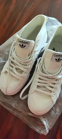 White Adidas High-Top Sneakers —
