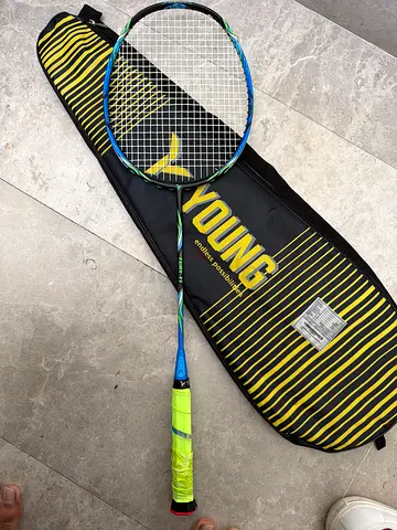 Used junior/adult badminton racket with cover - good condition