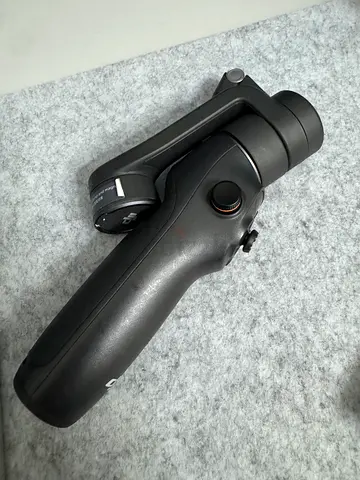 DJI Osmo Mobile handheld gimbal (single-axis/tripod grip) - used