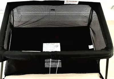As new Babybjorn mesh black cot