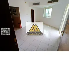 Studio in Al Rashidiya 3 Ajman. Balcony, wardrobes, separate kitchen, central AC. AED 18,000 yearly,