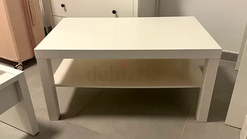Simple white coffee table with lower shelf - like new condition