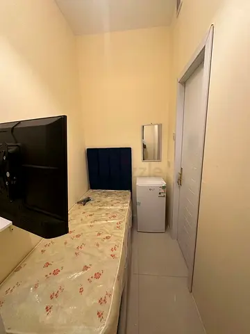 Available soundproof single partition with balcony, smart tv and fridge in silicon oasis