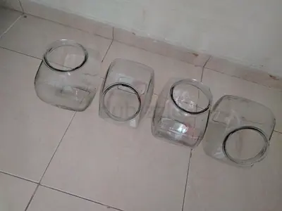Set of 4 clear glass storage jars/vases