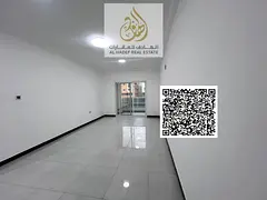 2BR hall in Al Mowaihat 3 Ajman, 2 baths, open view balcony, central AC, opposite Shouefat School, n