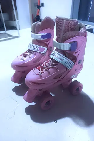 Pink adjustable kids quad roller skates — size adjustable, gently used Pro skating