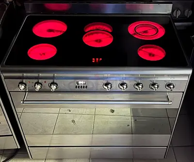 Stainless steel electric range with ceramic hob and large oven - good condition