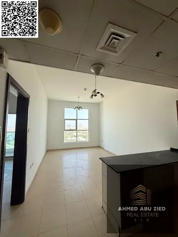 Luxury 1BHK apartment with 2 baths, open view balcony, free parking, full maintenance, prime location near Dubai & Sharjah exits and services