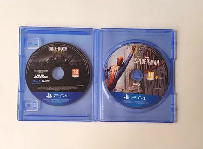 Two PS4 discs: Call of Duty WWII + Spider-Man (Discs Only within a case)