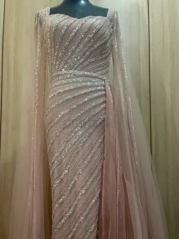 Long blush pink sequin evening gown with cape