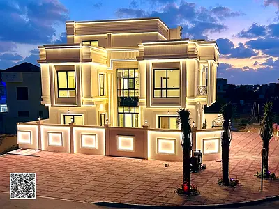 Villa (corner) (with swimming pool) for sale in Ajman | Al Helio 2 area | 5 bedrooms, majlis, 3 halls and roof | Freehold for all nationalities | Pric