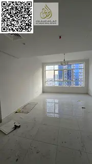 Two bedrooms, a large living room, two balconies, and two bathrooms in Al Rashidiya 3