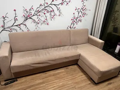 Beige L-shaped Sofa with Chaise — Good Condition with ample storage space underneath