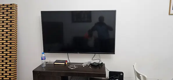 55 inch LED TV mounted with HDMI box and cables - good working condition