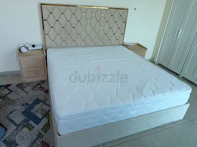 Queen bed frame with headboard, mattress and matching bedside tables - good condition