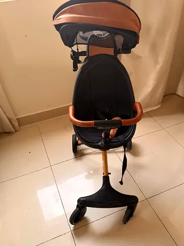 Well-kept three-wheel pram stroller with canopy