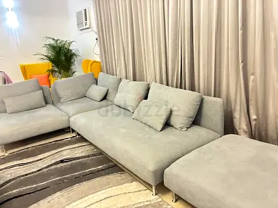 Light Grey Modern L-Shaped Sofa with Ottoman - Good Condition