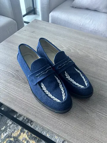 Pair of navy embroidered mens loafers - size 44