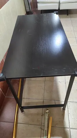Used black wooden dining/office table with metal frame - good condition