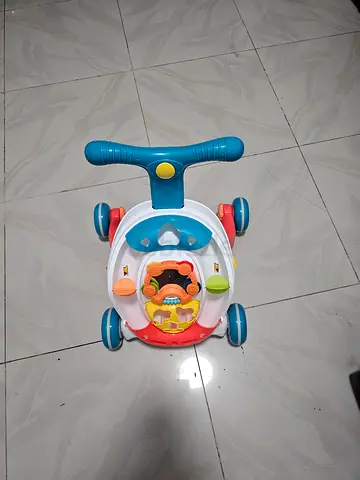 Multi-activity baby push walker with steering handle (used)