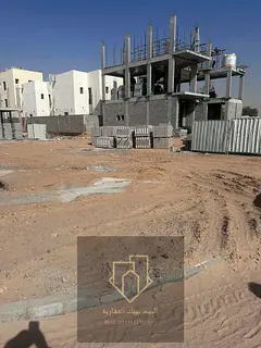 Corner plot of land on two streets and an alley in Al Yasmin, best exclusive price including registr