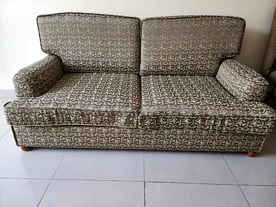 Two-seater patterned fabric sofa in good condition