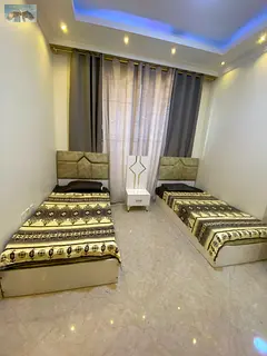 New and elegant furnishings for a beautiful two-bedroom apartment with a living room in Ajman, inclu