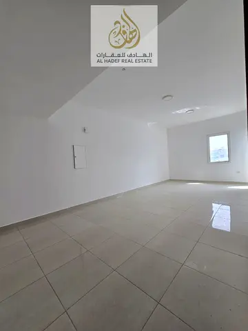For annual rent in Al Jurf 2, Ajman, a very spacious 3-bedroom apartment with a living room, designed to suit large families seeking comfort and priva