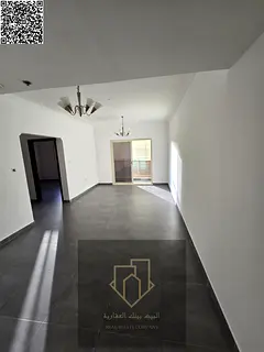 One bedroom and living room with a view of Al Ittihad Street