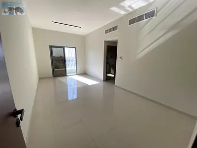 Two rooms and a hall for annual rent, lowest price in Ajman, first occupant, parking and one month free, close to the Sharjah and Dubai exit.