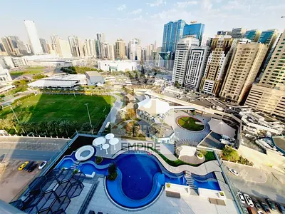 brand new building with balcony open view wardrobes good finishing gym pool and maintenance free also parking free prime location on main road building near close exit to dubai